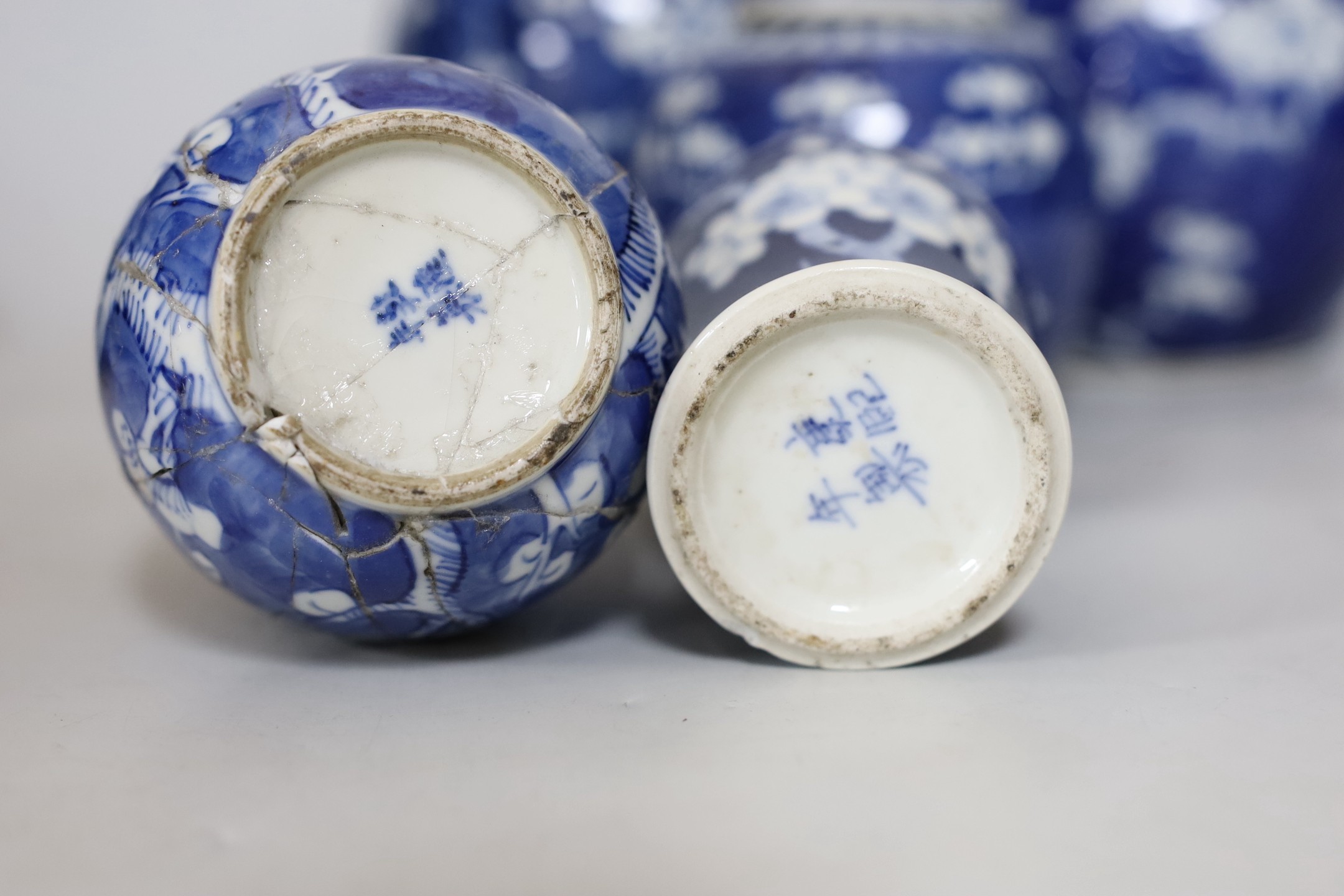 Four Chinese blue and white prunus pattern ginger jars, together with three similar vases. 19th/early 20th century, Tallest 15cm